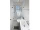 Updated bathroom featuring a glass-enclosed shower, modern fixtures, and a sleek vanity at 4715 W Chapin Ave, Tampa, FL 33611