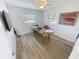 This bright room boasts wood-look flooring, a large desk, and two windows for ample natural light at 4715 W Chapin Ave, Tampa, FL 33611