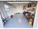 Spacious garage featuring epoxy floors, shelving, and room for storage and projects at 4715 W Chapin Ave, Tampa, FL 33611