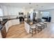 Modern kitchen featuring white cabinets, stainless steel appliances, and a large center island with seating at 4715 W Chapin Ave, Tampa, FL 33611