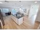 Open-concept layout featuring a kitchen island with seating and views of the living area and backyard at 4715 W Chapin Ave, Tampa, FL 33611