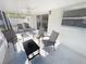 Screened-in porch with ceiling fan and plenty of seating provides a relaxing outdoor space at 4715 W Chapin Ave, Tampa, FL 33611
