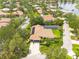 Beautiful home situated in a lush neighborhood, featuring a tile roof, screened-in pool, and mature trees at 4766 Royal Palm Ne Cir, St Petersburg, FL 33703
