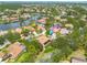 An aerial view of a neighborhood featuring tile roofs and community lakes at 4766 Royal Palm Ne Cir, St Petersburg, FL 33703