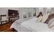 Comfortable bedroom with hardwood floors, ample natural light, and a view of the outdoor patio at 4766 Royal Palm Ne Cir, St Petersburg, FL 33703
