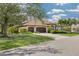 Attractive one-story house boasting an attached two-car garage, sprawling lawn, and tropical landscaping at 4766 Royal Palm Ne Cir, St Petersburg, FL 33703