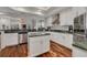 Bright kitchen with white cabinetry, stainless steel appliances, and granite countertops at 4766 Royal Palm Ne Cir, St Petersburg, FL 33703