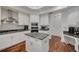 Modern kitchen features an island, stainless steel appliances, and ample storage at 4766 Royal Palm Ne Cir, St Petersburg, FL 33703