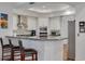 Well-equipped kitchen with granite countertop island and stainless steel appliances at 4766 Royal Palm Ne Cir, St Petersburg, FL 33703