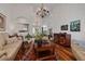 Spacious living room boasting hardwood floors, neutral-colored furnishings, and abundant natural light at 4766 Royal Palm Ne Cir, St Petersburg, FL 33703