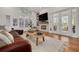 Spacious living room featuring a fireplace and large windows, filled with natural light at 4766 Royal Palm Ne Cir, St Petersburg, FL 33703