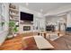Inviting living room with fireplace, wood floors, and access to dining and outdoor areas at 4766 Royal Palm Ne Cir, St Petersburg, FL 33703