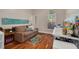 Office with wood floors, bright window, and comfortable couch at 4766 Royal Palm Ne Cir, St Petersburg, FL 33703