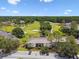Great aerial view of this condo surrounded by lush trees and golf course with ponds and sand traps at 4946 Mill Pond Rd # 3180, Wesley Chapel, FL 33543