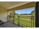 Enjoy golf course views from this condo's private balcony with decorative black iron railings at 4946 Mill Pond Rd # 3180, Wesley Chapel, FL 33543