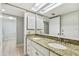 Bathroom featuring granite countertops, double sinks, and tile flooring at 4946 Mill Pond Rd # 3180, Wesley Chapel, FL 33543