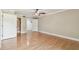 Bedroom featuring hardwood floors, ceiling fan, and closet space at 4946 Mill Pond Rd # 3180, Wesley Chapel, FL 33543