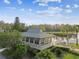 A charming lake house with a private dock offers scenic views and access to the serene lake at 4946 Mill Pond Rd # 3180, Wesley Chapel, FL 33543