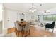Open-concept living and dining area featuring hardwood floors and neutral decor at 4946 Mill Pond Rd # 3180, Wesley Chapel, FL 33543