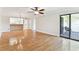 Spacious living room boasts beautiful floors, open access to kitchen, and sliding doors to the patio at 4946 Mill Pond Rd # 3180, Wesley Chapel, FL 33543