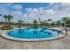 Resort-style pool area features comfortable lounge chairs and lush landscaping at 4946 Mill Pond Rd # 3180, Wesley Chapel, FL 33543