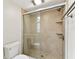 Modern bathroom featuring a glass enclosed shower with tile and built-in shelving at 4946 Mill Pond Rd # 3180, Wesley Chapel, FL 33543