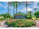Welcome to Saddlebrook! Beautiful community entrance sign with colorful flowers at 4946 Mill Pond Rd # 3180, Wesley Chapel, FL 33543