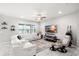 Living room featuring modern white sofas, a ceiling fan, and shelves with decorative plants at 5014 Fallen Leaf Dr, Riverview, FL 33578