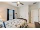 Cozy bedroom featuring neutral carpet, leaf decorations, and a ceiling fan at 5521 Limelight Dr, Apollo Beach, FL 33572