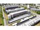 Aerial view of a condo community showcasing multiple buildings and parking at 5623 80Th N St # 202, St Petersburg, FL 33709