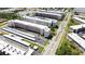 Aerial view of a condo community with parking lots and landscaping at 5623 80Th N St # 202, St Petersburg, FL 33709