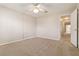 Bedroom showcasing neutral paint, carpeted floor, and access to an adjacent room at 5623 80Th N St # 202, St Petersburg, FL 33709
