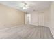 Comfortable bedroom with soft carpeting, ceiling fan, and closet at 5623 80Th N St # 202, St Petersburg, FL 33709