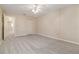 Inviting bedroom with soft carpeting, ceiling fan, and closet at 5623 80Th N St # 202, St Petersburg, FL 33709