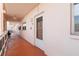 Exterior view of a condo building hallway with unit 202 at 5623 80Th N St # 202, St Petersburg, FL 33709