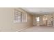 Cozy living room with natural lighting and neutral carpet flooring at 5623 80Th N St # 202, St Petersburg, FL 33709