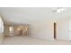 Spacious living room with neutral carpet and multiple windows for natural light at 5623 80Th N St # 202, St Petersburg, FL 33709