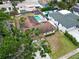 Aerial view of a property with a pool, backyard, boat, showcasing the home's layout and amenities at 5920 Denver Ne St, St Petersburg, FL 33703