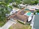 Overhead shot of a home featuring a pool, backyard, and boat, providing a detailed view at 5920 Denver Ne St, St Petersburg, FL 33703