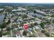 A picturesque aerial perspective of a home featuring a lovely pool, nestled in a vibrant lakeside community at 5920 Denver Ne St, St Petersburg, FL 33703