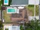 A bird's eye view captures a backyard pool, boat, and the roof of a cozy home and surrounding landscape at 5920 Denver Ne St, St Petersburg, FL 33703
