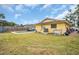 View of a home's backyard, showcasing the pool, fencing, and some boats on the side at 5920 Denver Ne St, St Petersburg, FL 33703