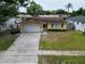 Charming exterior showcasing the driveway and front yard at 5920 Denver Ne St, St Petersburg, FL 33703