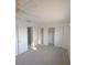 Bright bedroom with closet and neutral carpet at 614 Guild Dr # 15, Venice, FL 34285