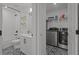 This bathroom/laundry room has a single vanity, shower/tub, and washer/dryer at 710 W River Heights Ave, Tampa, FL 33603