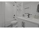 This well-lit bathroom features tile floors, a shower/tub, and single vanity at 710 W River Heights Ave, Tampa, FL 33603