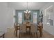 Inviting dining room featuring a wood table, seating for six, and natural light at 710 W River Heights Ave, Tampa, FL 33603