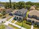 Beautiful two-story home featuring a covered front porch, landscaped yard, and sidewalk access at 710 W River Heights Ave, Tampa, FL 33603