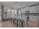 Modern kitchen with a large center island, pendant lighting, and a breakfast bar at 710 W River Heights Ave, Tampa, FL 33603