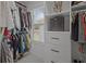 Organized walk-in closet with custom shelving and drawers, maximizing storage space and functionality at 710 W River Heights Ave, Tampa, FL 33603